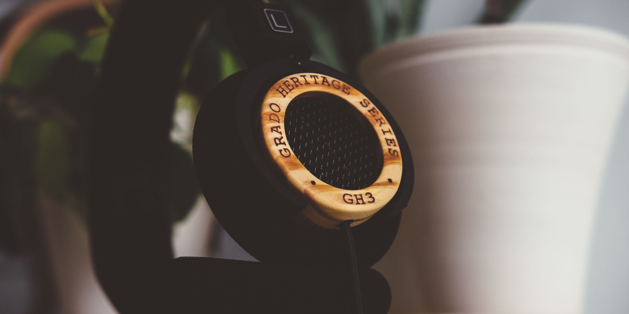 Photo of GH3 Headphone in next to a white planter
